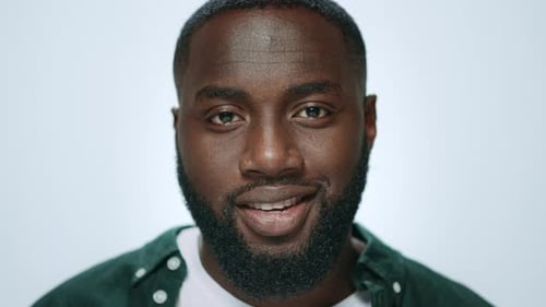Portrait African American Man Smiling on Grey Background in Studio. Closeup Smiling