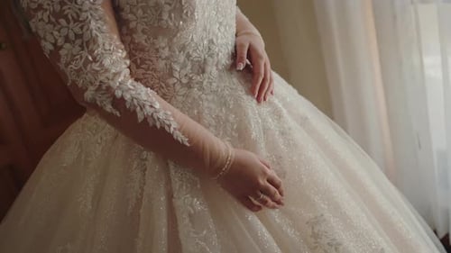 Bride Wearing Lacy White Wedding Gown and Bracelets