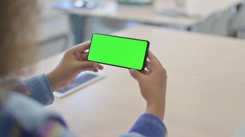 Close Up of Young African Woman Holding Phone with Chroma Key Screen