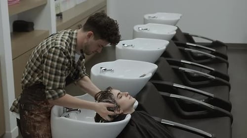 Woman Receiving Relaxing Hair Wash at Salon