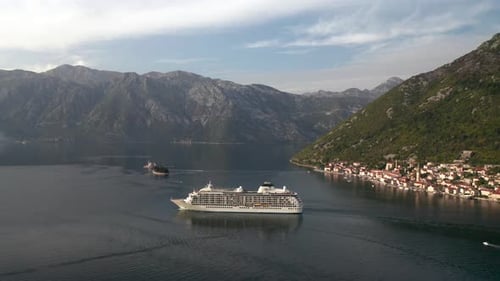 Large cruise ship passing through the picturesque bay of Kotor in Montenegro