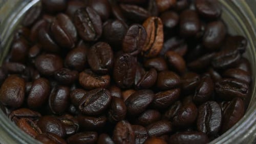 Dark Roasted Coffee Beans in a Glass Jar