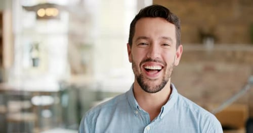 4k video footage of a cheerful young businessman in his office