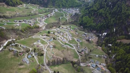 Aerial view over peaceful French Alps mountainside village in summer