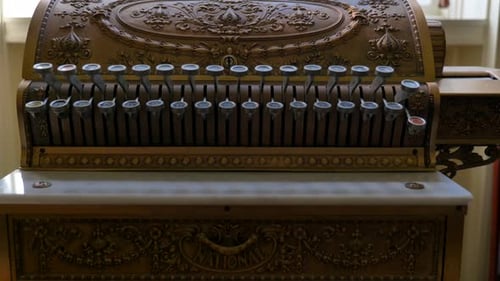 View of an anciet Cash register. Or antique with latches and No sale in the viewing glass