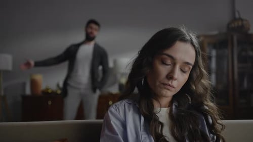 Tense Couple Arguing in Living Room