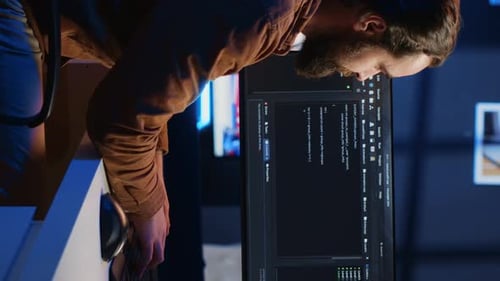 Programmer Developing Code on Computer Screen While in Personal Office