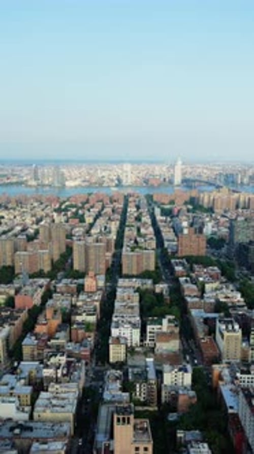 Vertical Aerial Perspective of New York City's Urban Landscape Featuring Manhattan Bridge Over East