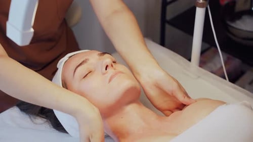 Woman Receiving Face Massage at a Spa