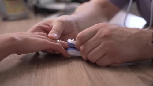 Pulse Oximeter Attached to Patient's Finger
