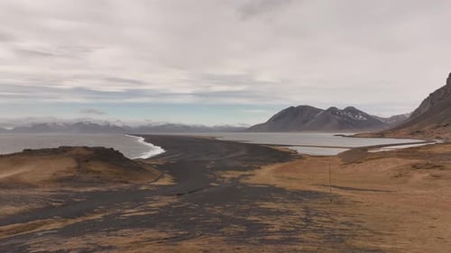 Black sand beach and rugged peaks of Stokksnes, Iceland, with Vestrahorn in the background.