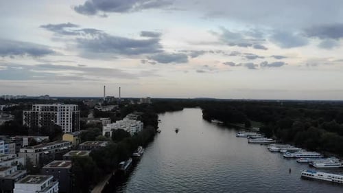 Drone 4k forward motion Berlin towards the east at sunset in summer with Treptower Park and Spreeins