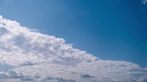 Clouds Moving Slowly in a Blue Sky