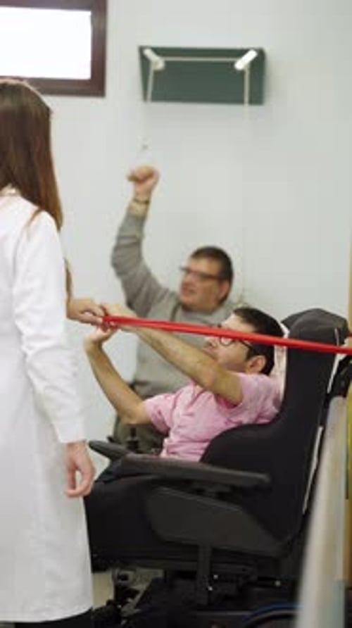 Physical Therapy Session with Therapist and Patient