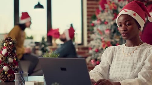 African American People Exchanging Xmas Gifts in Office