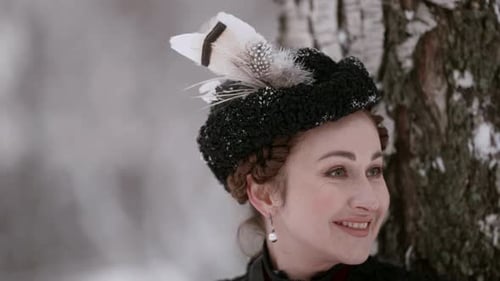 Woman in Vintage Clothing by Birch Tree in Winter