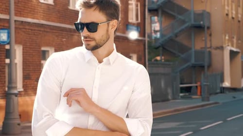 Stylish Man Walks Confidently in City Street