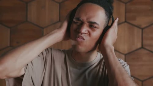 Young Adult Lip-Syncing with Headphones On