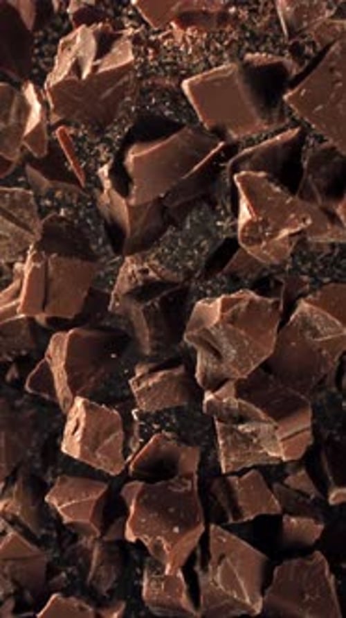 Pieces of Chocolate Fly Up and Fall Down Filmed on a Highspeed Camera at 1000 Fps