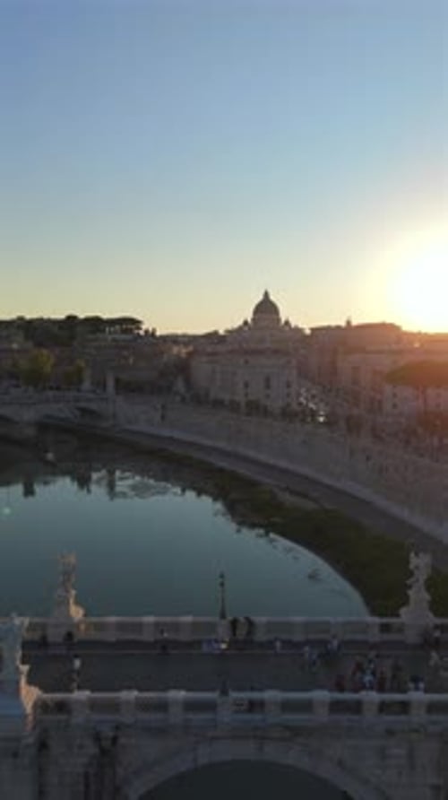 Breathtakingly Stunning Sunset Over the Tiber River in Rome Highlighting the Historic Bridge