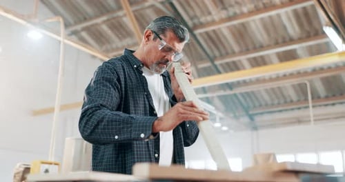 Man, sanding and sawdust for woodwork as carpenter in workshop for furniture