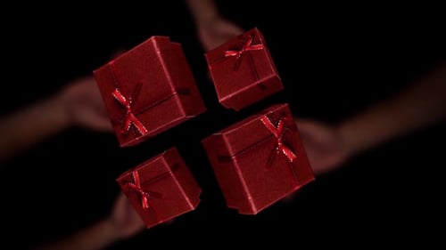 Red Gift Boxes Floating on Black Background