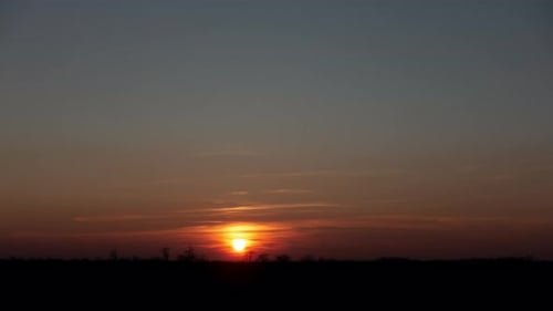 Golden Hour Sunrise Over Rural Landscape