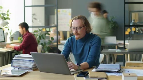 Timelapse of Man Overloaded with Work in Office