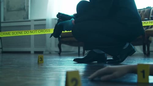 Investigator Photographs Crime Scene Evidence