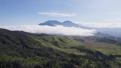 Aerial view of beautiful sky in misty mountains nature in the distance covered in clouds
