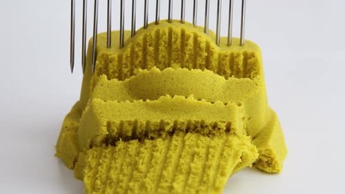 Kinetic Sand Flower Pot Being Cut Into Pieces