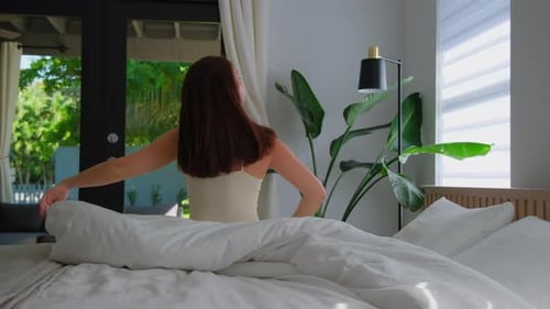 Silhouette of Palm Trees on Beach at Colorful Red Sunset Time