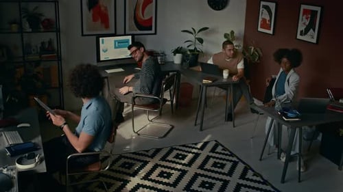 Group of Colleagues Talking While Working in Open Space Office