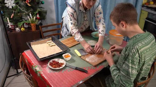 Grandmother and Grandson Baking Festive Treats Together