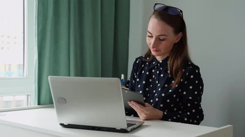 Woman Attending Meeting from Home Office