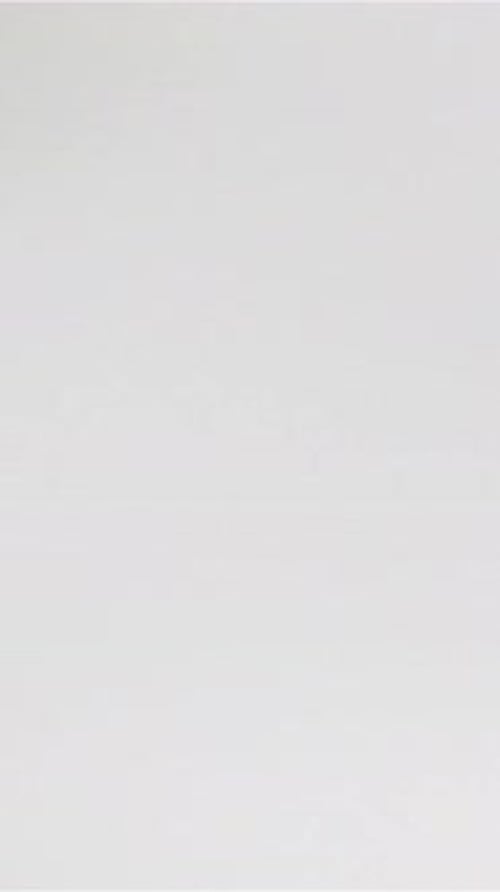 Fresh Lettuce Leaves Falling Against White Background