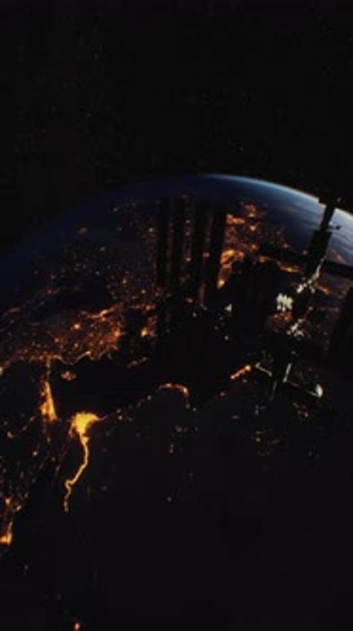 View of the International Space Station Orbiting the Earth at Night