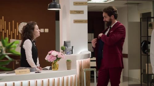 Well Dressed Man Checking In to Hotel Lobby