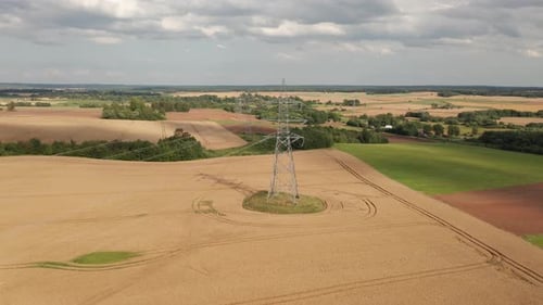 Aerial View of a Power Line Tower Structure in a Rural Area