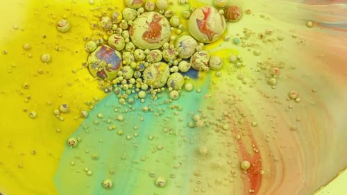 Abstract Spheres Floating in Vibrant Liquid