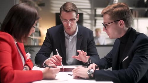 Business People Talking Strategy With Tablet At Office Desk In Creative Team In Office Productive