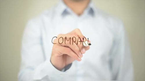 Hand Writing Word Compare on Clear Surface