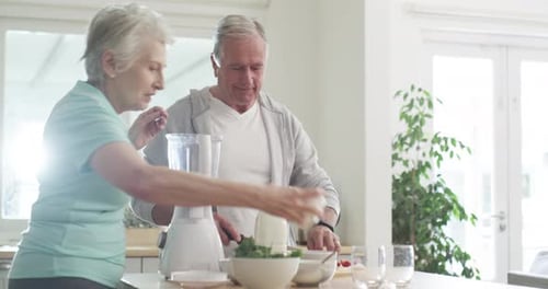 Senior Couple Making Healthy Smoothie in Kitchen