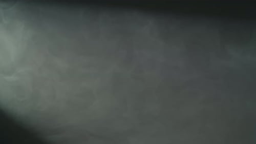 Dense Fluffy Smoke Fog in Spotlight in Studio on Black Background Abstract Smoky Clouds