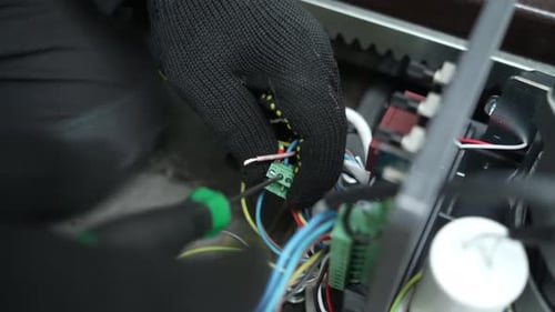 Hands Adjusting Electronic Circuit Board Wiring
