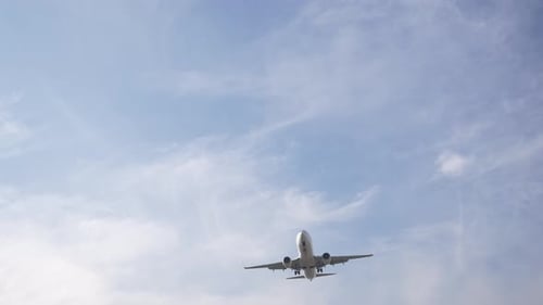Overhead View of Passenger Airline Approaching Before Landing Flying Above at Civilian Airport