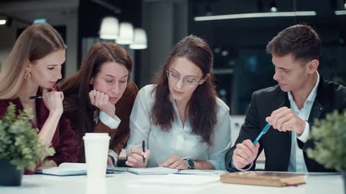 Brainstorming a Creative Team Colleagues Work Together in a Small Modern Office