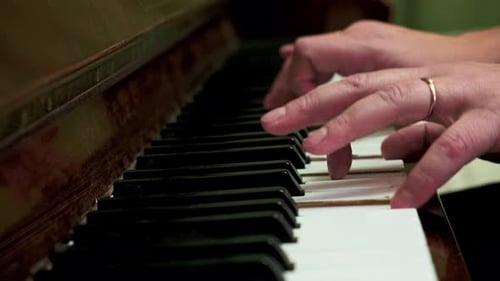 Piano Keys Close-Up with Hands Playing