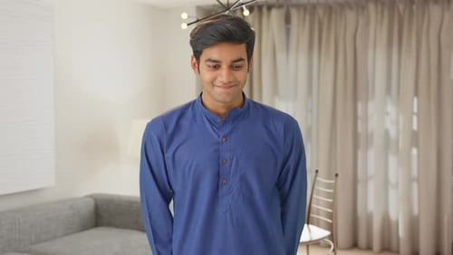 Smiling Young Adult Man in Blue Kurta Indoors
