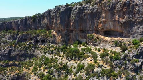 Aerial View of Canyon Walls and Cave Formations